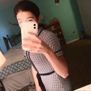 Patterned slim fit dress with sash.